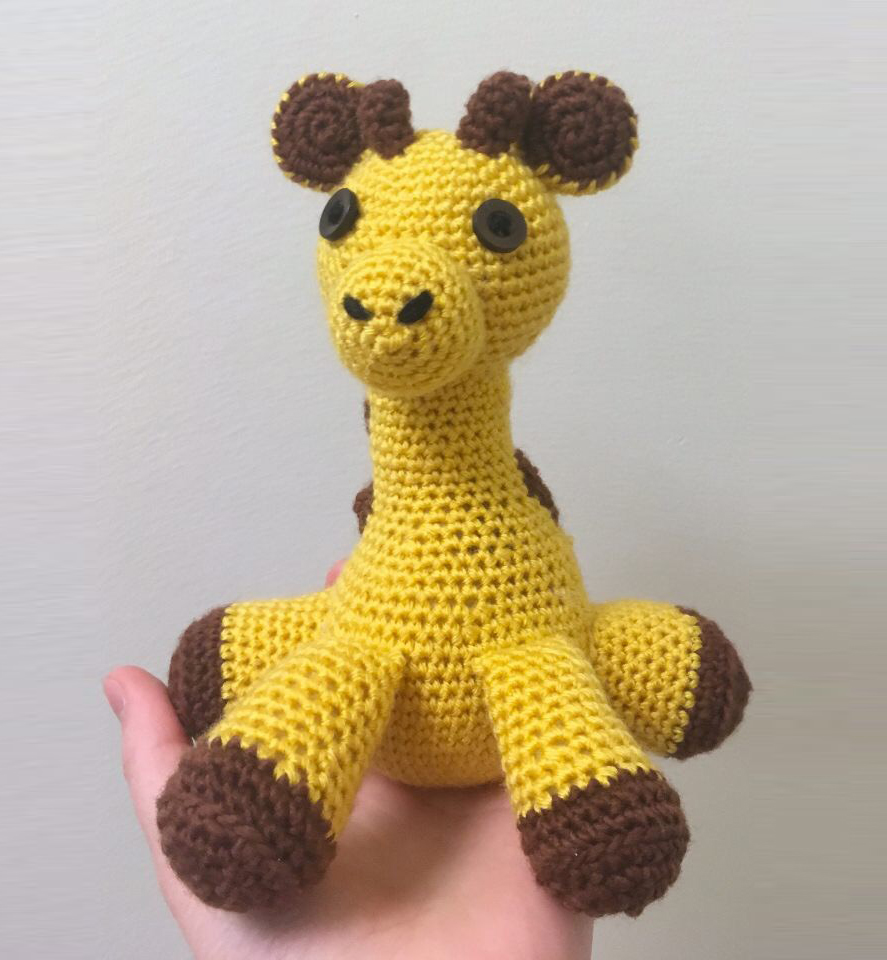 A crocheted yellow giraffe