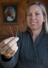 Abby Greiner ’96 holds needles used in her acupuncture practice.