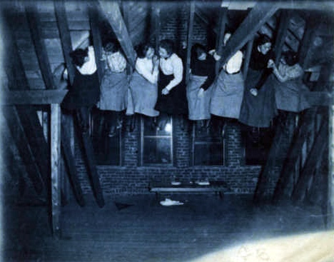 Students eat snacks in the rafters of Pearons, 1901.