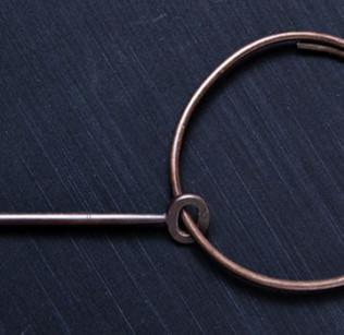 The key, thought to be made of brass, measures five inches in length and hangs on a circular ring measuring five inches across. Photo by Joanna Chattman