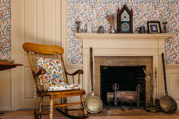 Rocking chair and fireplace at Sycamores