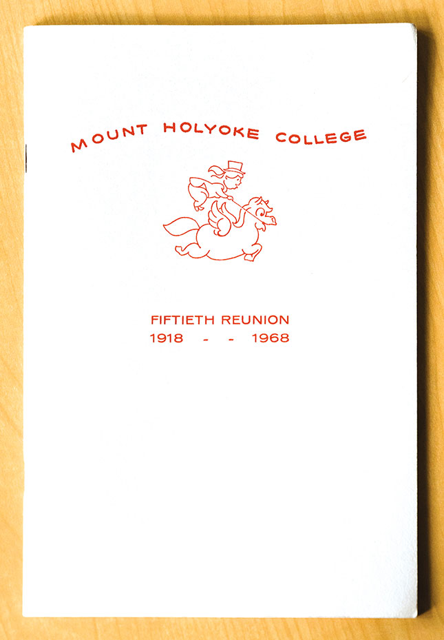 Cover of 50th reunion booklet with bouncing hatted rider