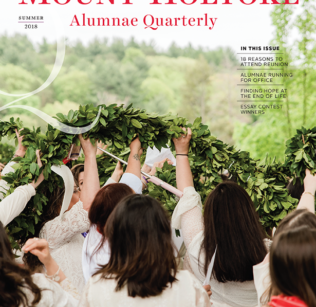 Cover of Summer Quarterly with graduates raising the laurel chain