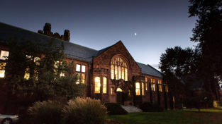 The library as seen at night from outside on College Street.
